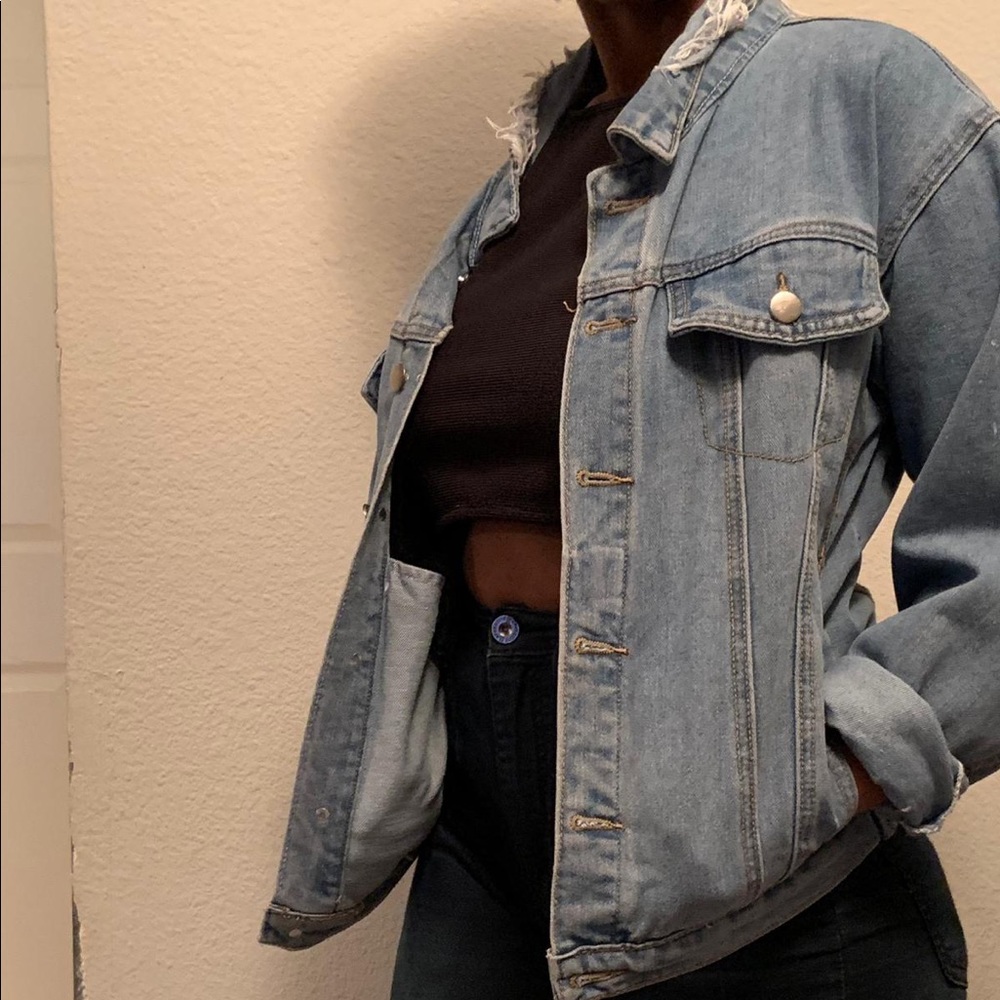 Distressed light blue denim jacket